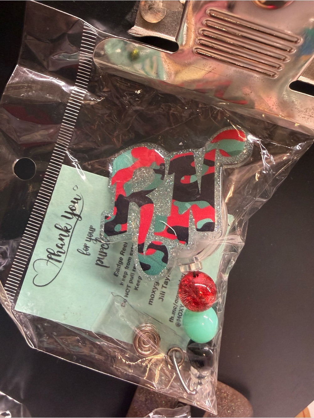 Acrylic Initial 'RN' badge reel with Red & Teal Camo